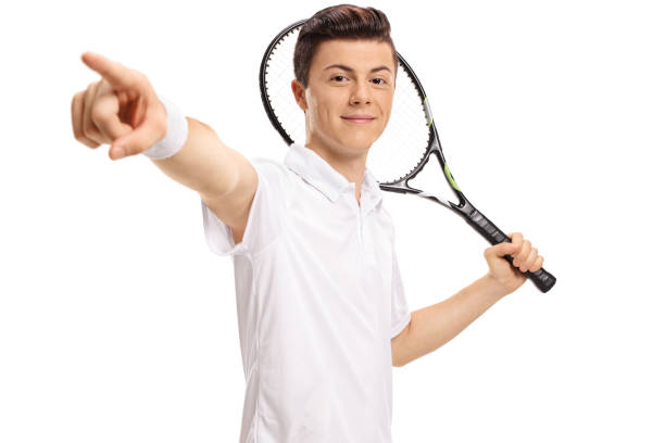 istock Teen tennis player with a racket pointing 894412678
