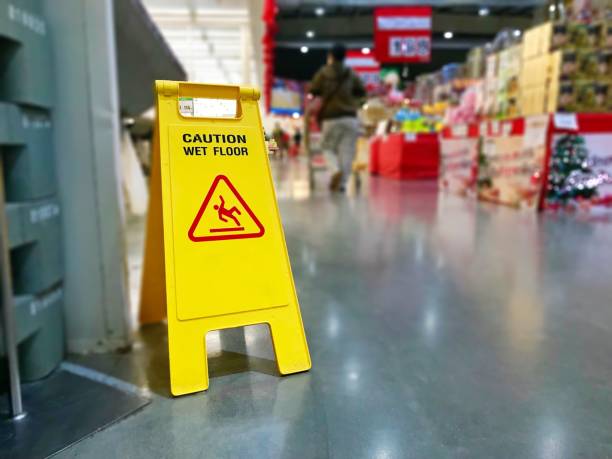 Warning label caution wet floor in the mall stock photo