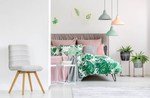 istock Spacious colorful bedroom with chair 894420124