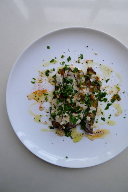 istock Marinated Eggplant with tahini and parsley 894430210