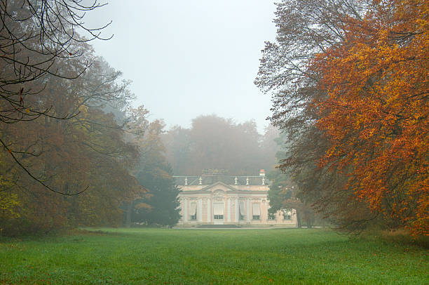 Amalienburg in Munich on a foggy autumn day Amalienburg, part of the Nymphenburg Castle in Munich, Germany on a foggy Autumn day early in the morning. amalienburg hunting lodge stock pictures, royalty-free photos & images
