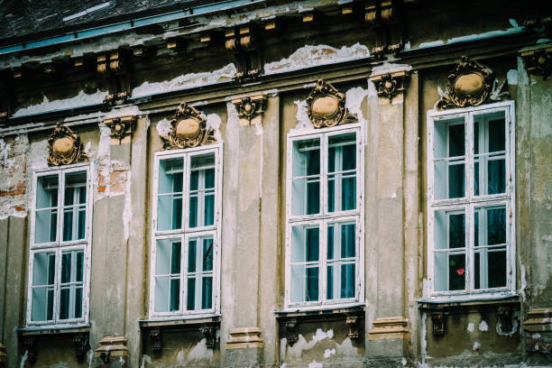 Old historical building demolition in the city center. Old house decay in the European city street, build in barque style. deconstruct stock pictures, royalty-free photos & images