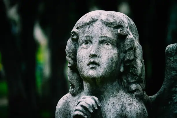 Photo of Mystic old statue of the praying angel.