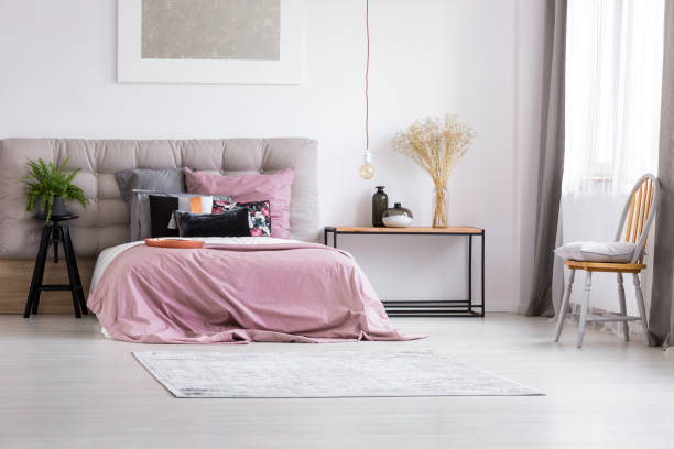istock Minimalist bedroom with contemporary lighting 894433116