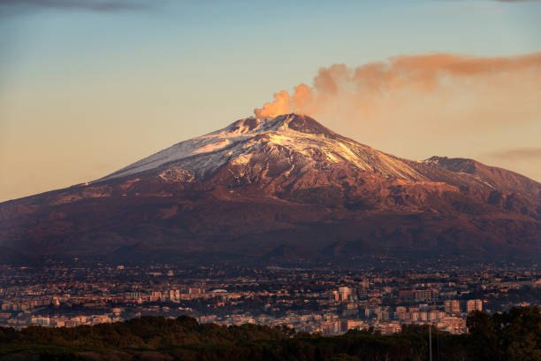 Mount Etna Volcano and Catania city - Sicily island Italy The mount Etna Volcano with smoke and the Catania city, Sicily island, Italy (Sicilia, Italia) active volcano photos stock pictures, royalty-free photos & images
