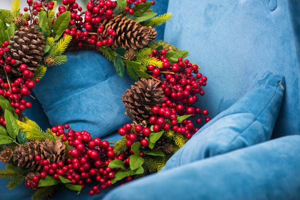 istock holiday christmas wreath with pine cones 894433592
