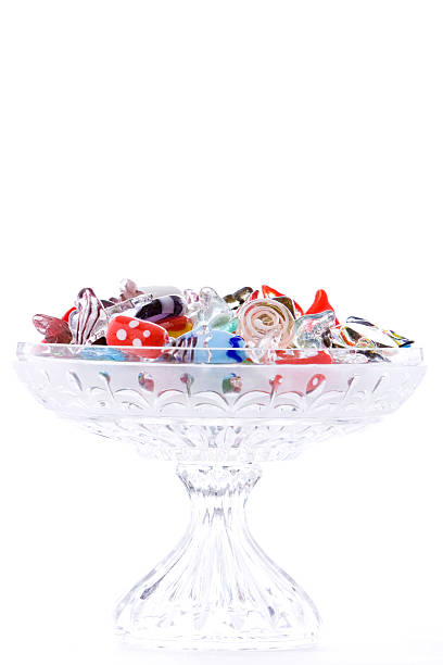 Shiny Glass Candy in Crystal Dish Isolated on White stock photo