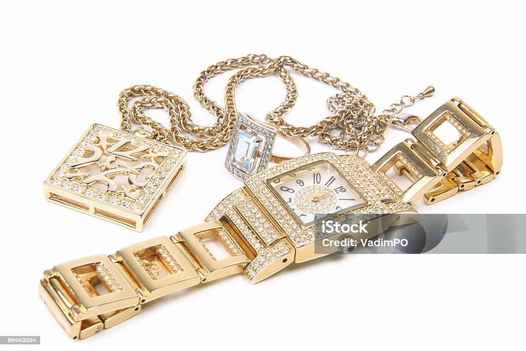 Golden watch ring and necklace  Watch - Timepiece Stock Photo