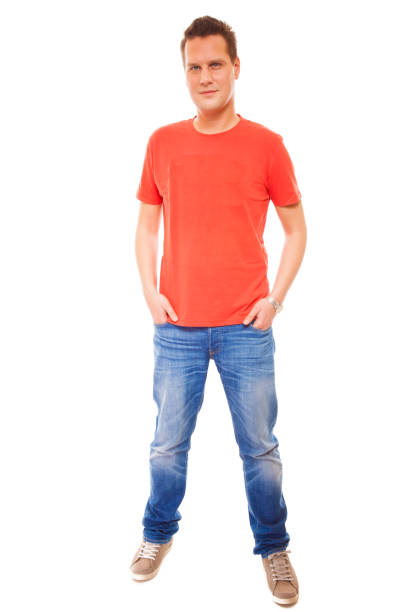 istock Young man guy red t-shirt jaens with hands in pockets isolated 894436104