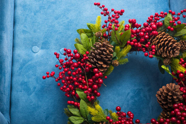 istock holiday christmas wreath with pine cones 894436252