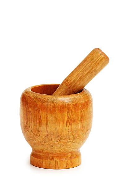 istock Old wooden mortar and pestle isolated on white 89443735