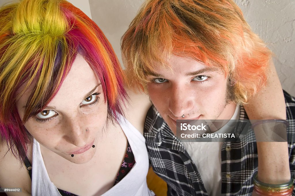 Young Couple with Bright Colored Hair Embrace  Friendship Stock Photo