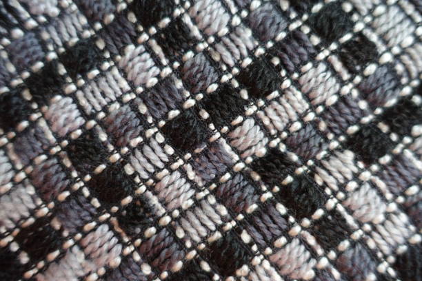 istock Gray fabric with diagonal stitches from above 894442494