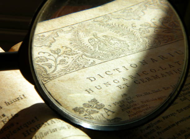 istock Old Bible and magnifying glass 894442850