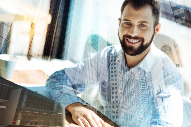 istock Young pleasant man smiling and looking straight 894442894