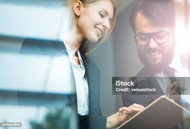 Team Partners Working In Glass Office Stock Photo - Download Image Now - Business Meeting, Office, Business