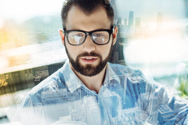 istock Handsome unshaken man observing something interesting in it 894443336