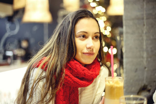 istock Young woman in a cafe drinking coffee 894445926