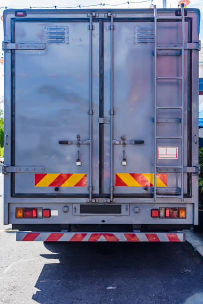 istock Back side of modern truck standard metal container 894446112