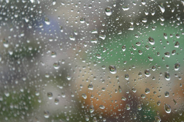 istock Drops of rain on the window, rainy day 894446178