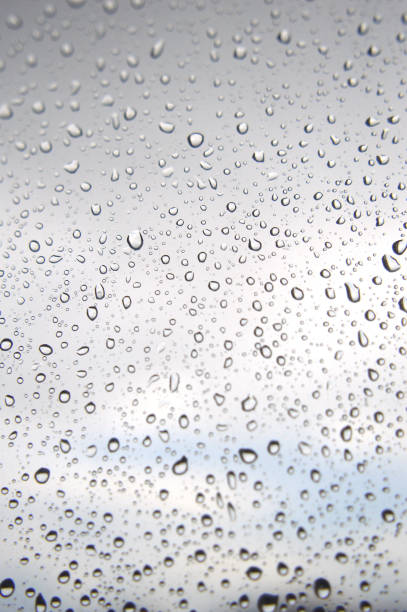 istock Drops of rain on the window, rainy day 894446698
