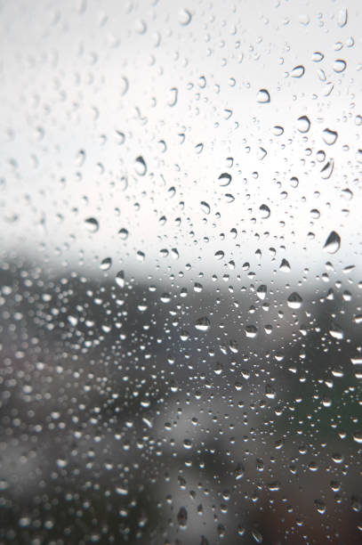 istock Drops of rain on the window, rainy day 894446820