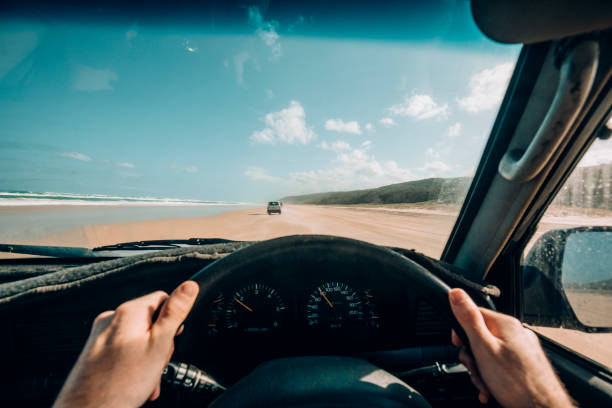 Point of View Driving on Fraser Island Point of view shot of a man driving a 4x4 along the 75 Mile Beach on Fraser Island, Australia. car point of view stock pictures, royalty-free photos & images