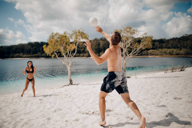 istock Playing Volleyball on the Beach 894449834