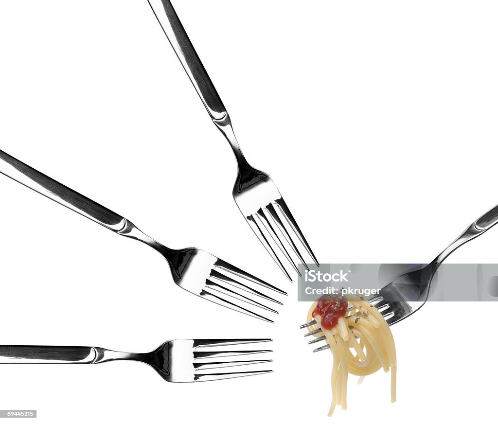 Spaghetti pasta and tomato sauce twirled on a fork.  Close-up Stock Photo