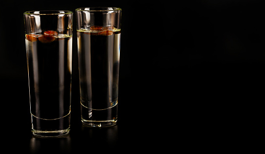 aromatic anise alcohol with coffee beans in a glass, drink set, party drink