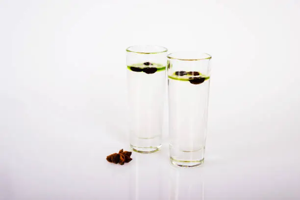 aromatic anise alcohol with coffee beans in a glass, drink set, party drink