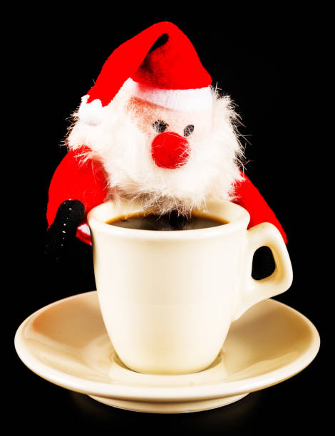 istock black coffee in a white cup and plush Santa Claus, drink set 894456790