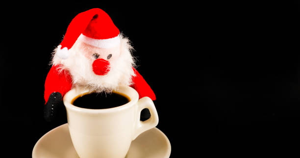 istock black coffee in a white cup and plush Santa Claus, drink set 894456816
