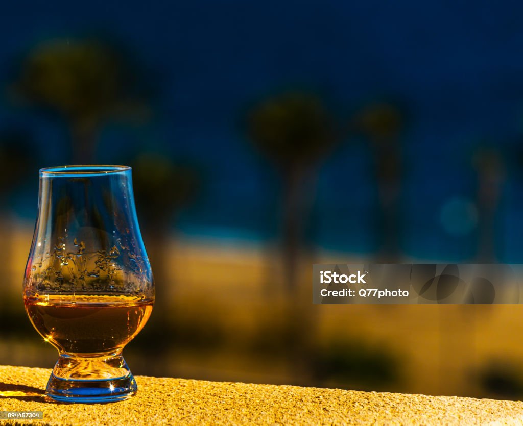 single malt whisky  in the glass, luxurious tasting glass single malt whisky  in the glass, luxurious tasting glass, tasty set Glencairn Whisky Glass Stock Photo