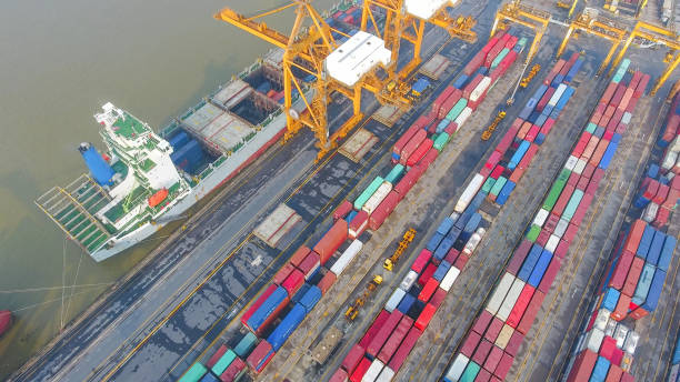 istock Logistics and transportation of Container Cargo ship and Cargo working crane bridge in shipyard 894460822