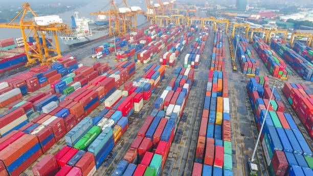 istock Logistics and transportation of Container Cargo ship and Cargo working crane bridge in shipyard 894460924