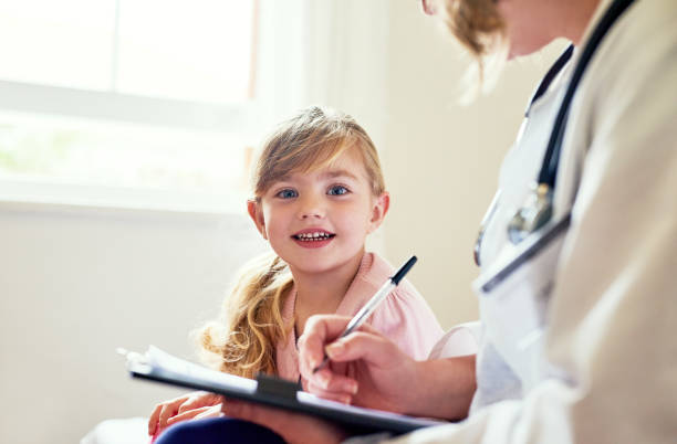 istock My doctor makes sure I'm growing up strong and heathy 894463904