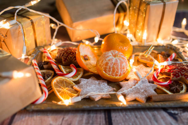 istock Christmas background with lights, ornaments, candy and decorations. Free space 894463984