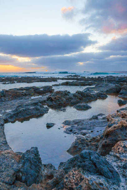 istock Punta del Hidalgo rock beach at sunset 894468970
