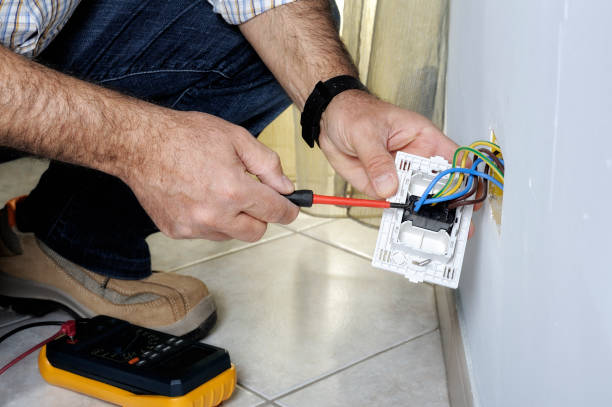 istock Electrician working in a residential electrical system 894471528