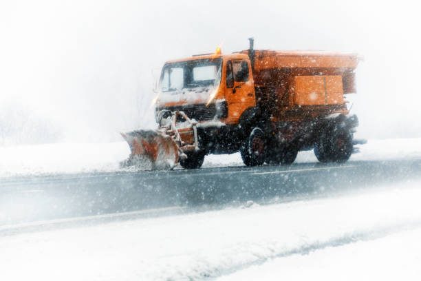 istock Snow plow clearing a snowy highway 894507042