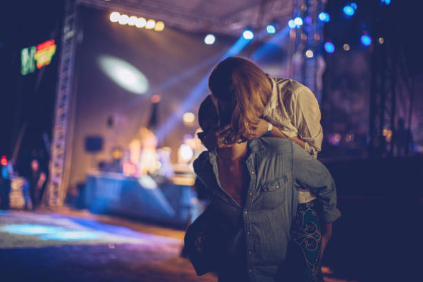 istock Kissing on music festival 894507366