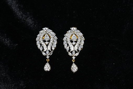 American diamond earrings jewellary closeup image on black background