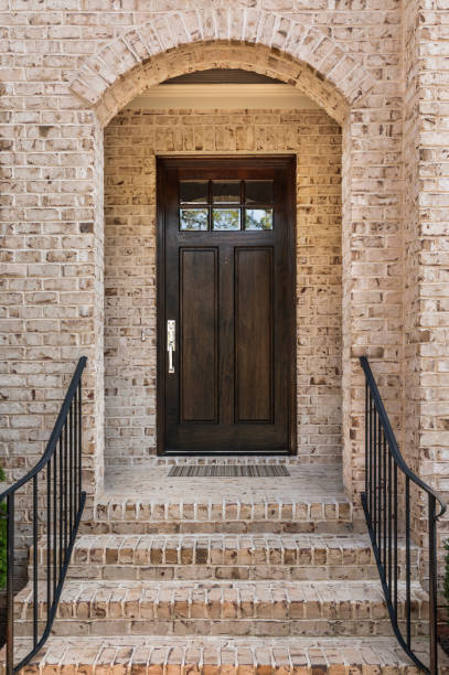 istock Front door, brown front door, exterior view 894520748