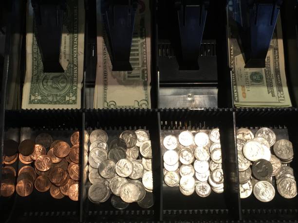 istock Money in a cash drawer looking down from above 894523744