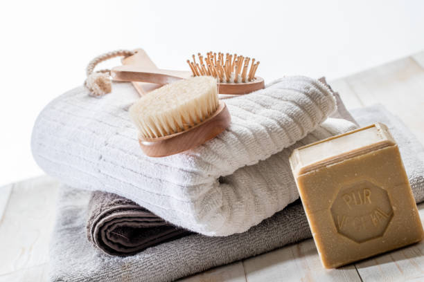 istock wooden brushes, solid soap and towels for green friendly bath 894527862