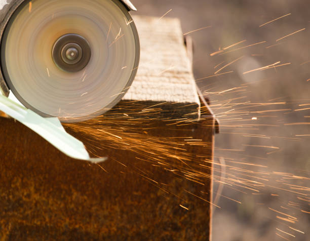 istock Working cut the metal sheet of the siding 894527950