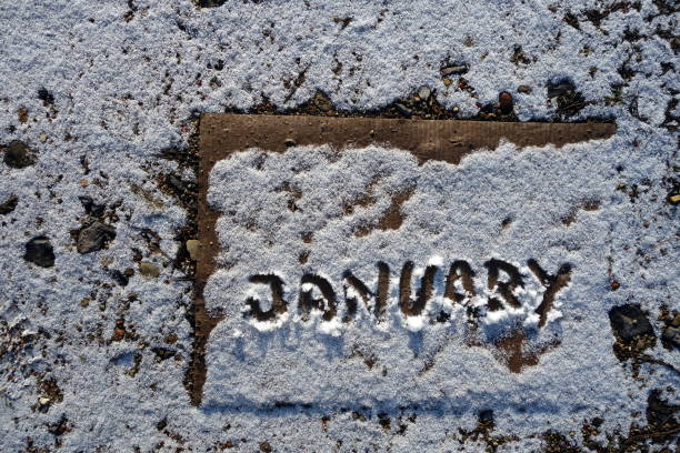 istock Word january written on old snowy cardboard 894532314