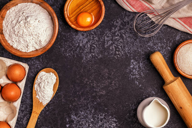 istock Ingredients for baking  - flour, wooden spoon, rolling pin, eggs. 894536268