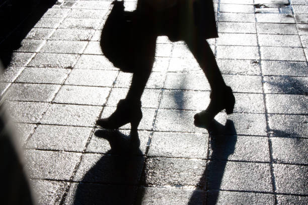 Legs of young woman walking